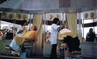 'Hollywood make-up artists transform a couple from the audience into Frankenstein and his bride' (from Inside Universal Studios, 1975)