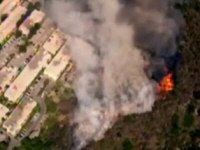 Helicopter view of the brush fire, showing how close it got to the Oakwood Toluca Hills housing complex, from KTLA website video