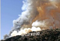 The ridge just behind the Hollywood sign was the main seat of the fire (from latimes.com, photo by Deposee)